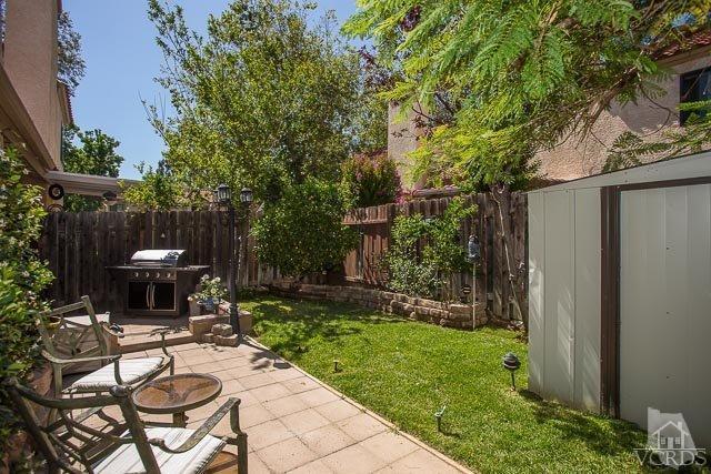 5833 Cochran Street Simi Valley, CA 93063 - Photo 16 of 28 a view of a chair and table in backyard of the house