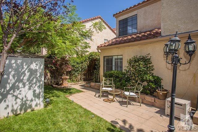 5833 Cochran Street Simi Valley, CA 93063 - Photo 19 of 28 a view of a patio with a table and chairs and potted plants