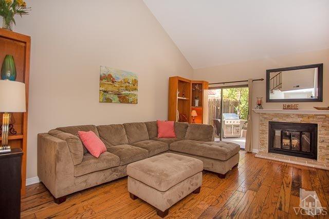 5833 Cochran Street Simi Valley, CA 93063 - Photo 24 of 28 a living room with furniture and a fireplace