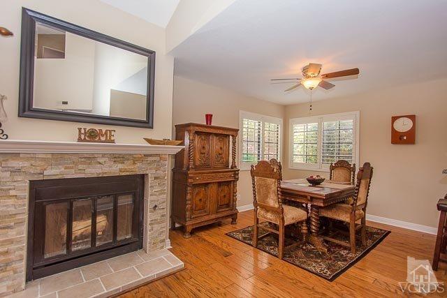 5833 Cochran Street Simi Valley, CA 93063 - Photo 25 of 28 a living room with furniture and a fireplace