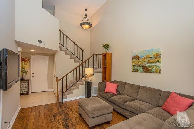 5833 Cochran Street Simi Valley, CA 93063 - Photo 26 of 28 a living room with furniture and a flat screen tv