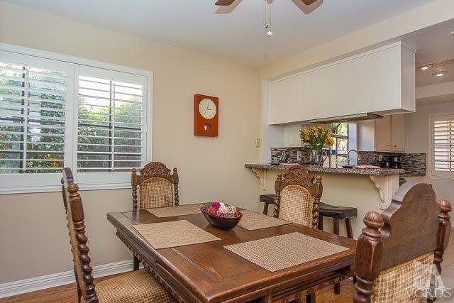 5833 Cochran Street Simi Valley, CA 93063 - Photo 27 of 28 a view of a dining room with furniture and a window