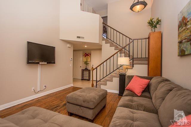 5833 Cochran Street Simi Valley, CA 93063 - Photo 10 of 28 a living room with furniture and a flat screen tv