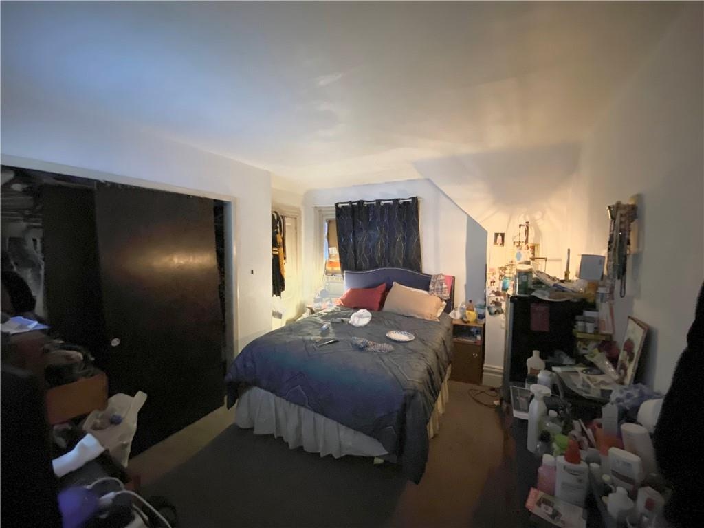 1038 Ridge Avenue Coraopolis, PA 15108 - Photo 13 of 17 a bed room with a bed and a tv