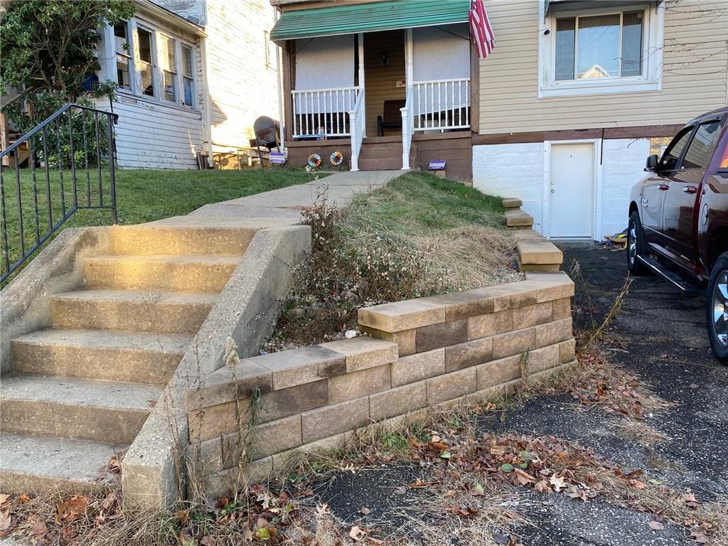 1038 Ridge Avenue Coraopolis, PA 15108 - Photo 2 of 17 a front view of a house with garden