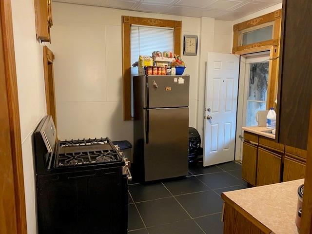 1038 Ridge Avenue Coraopolis, PA 15108 - Photo 5 of 17 a kitchen with a refrigerator and a stove