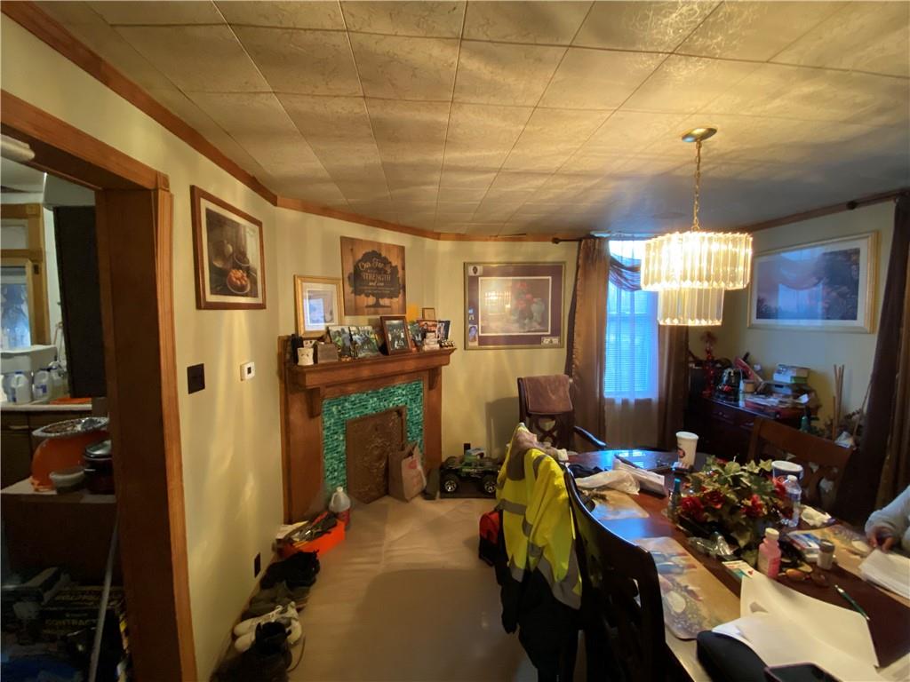 1038 Ridge Avenue Coraopolis, PA 15108 - Photo 8 of 17 a room with lots of furniture and chandelier