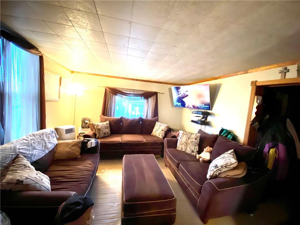 1038 Ridge Avenue Coraopolis, PA 15108 - Photo 9 of 17 a living room with furniture and a large window