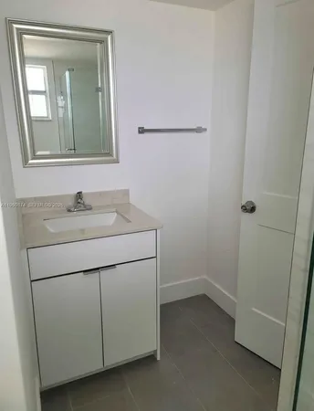 a bathroom with a sink and vanity