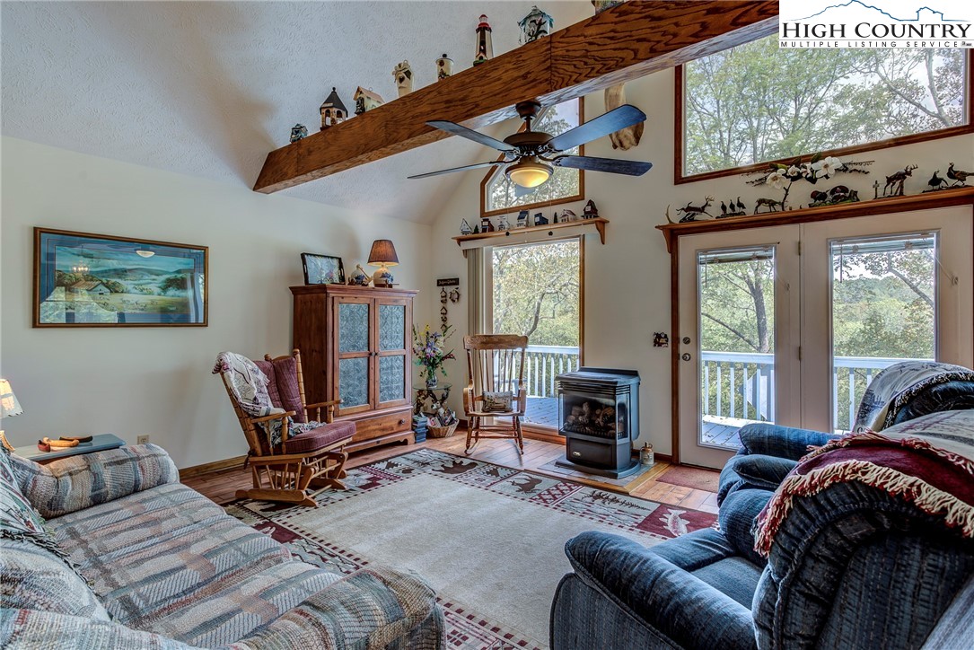 2164 River Bend Road Mouth Of Wilson, VA 24363 - Photo 16 of 50 a living room with furniture a fireplace and a flat screen tv