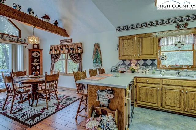 a view of a dining room with furniture and window