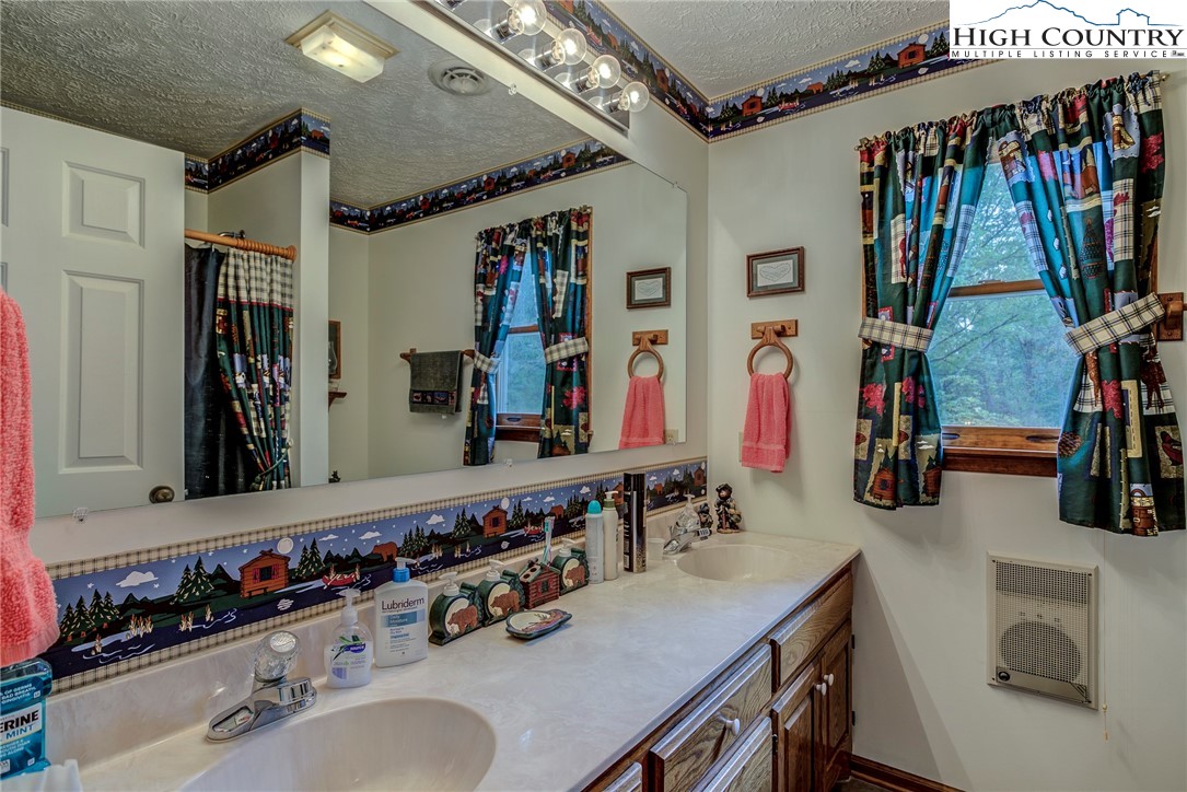 2164 River Bend Road Mouth Of Wilson, VA 24363 - Photo 27 of 50 a bathroom with a sink double vanity