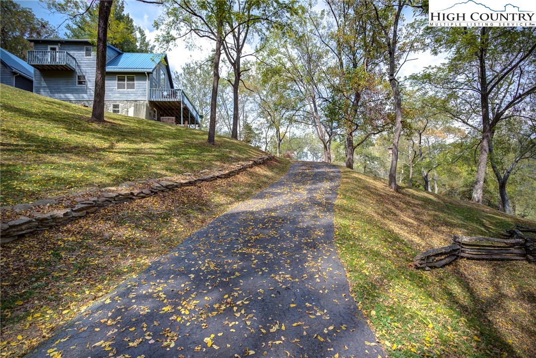 2164 River Bend Road Mouth Of Wilson, VA 24363 - Photo 42 of 50 a view of a house with backyard and tree