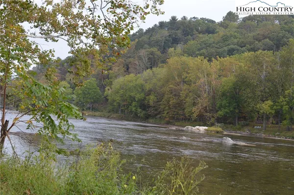 a view of a lake with a yard