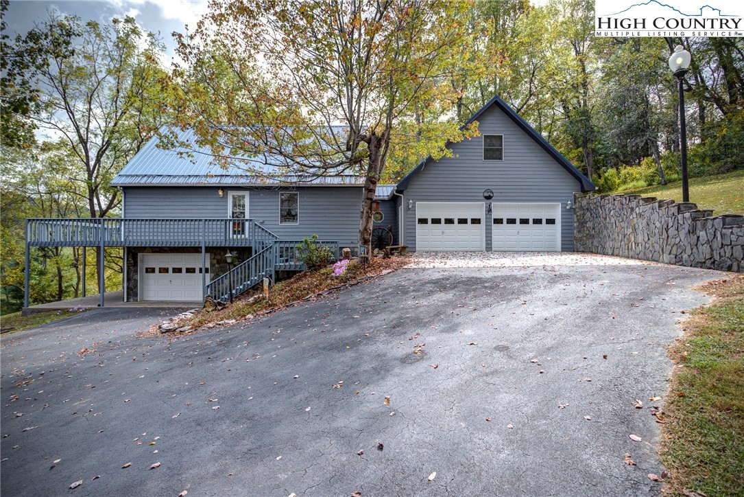 2164 River Bend Road Mouth Of Wilson, VA 24363 - Photo 5 of 50 a view of a house with wooden fence next to a road