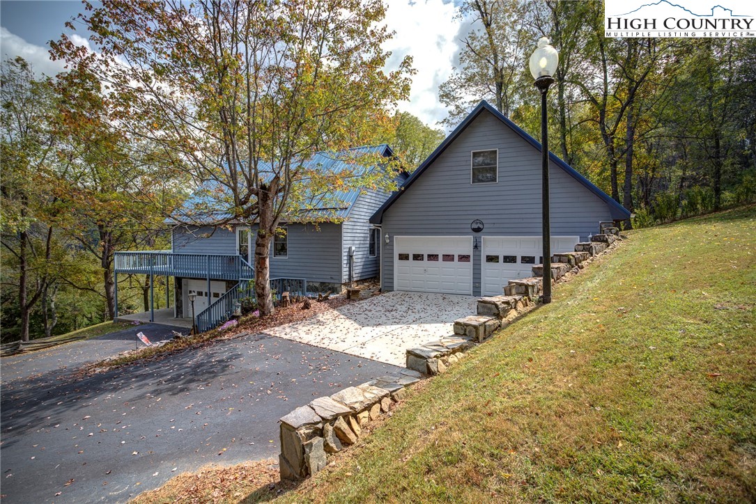 2164 River Bend Road Mouth Of Wilson, VA 24363 - Photo 6 of 50 a view of a house with large trees and a big yard