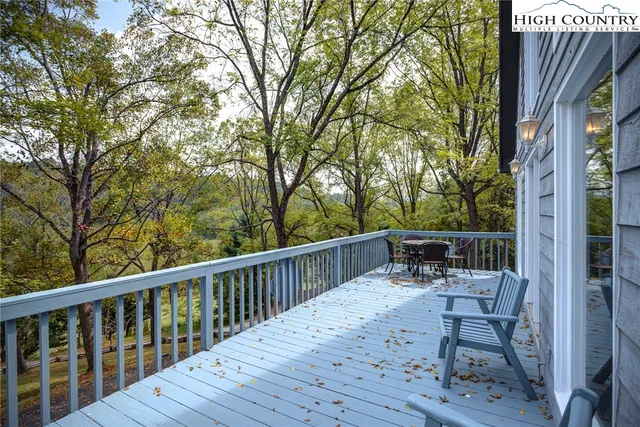 a view of backyard with a table and chairs