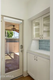 a view of a door and a window