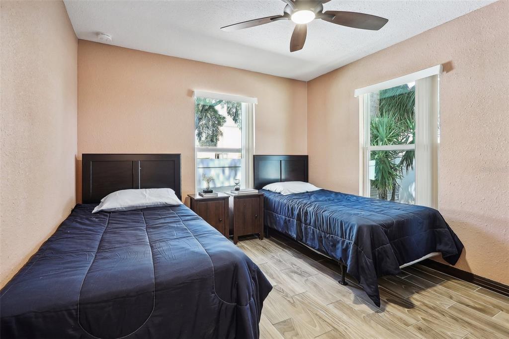 201 Rosefield Avenue Leesburg, FL 34748 - Photo 23 of 43 a bedroom with bed and a large window