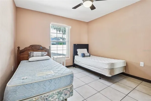 a bedroom with a bed and window