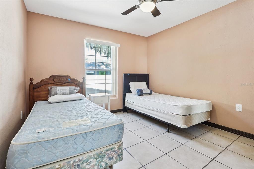 201 Rosefield Avenue Leesburg, FL 34748 - Photo 25 of 43 a bedroom with a bed and window