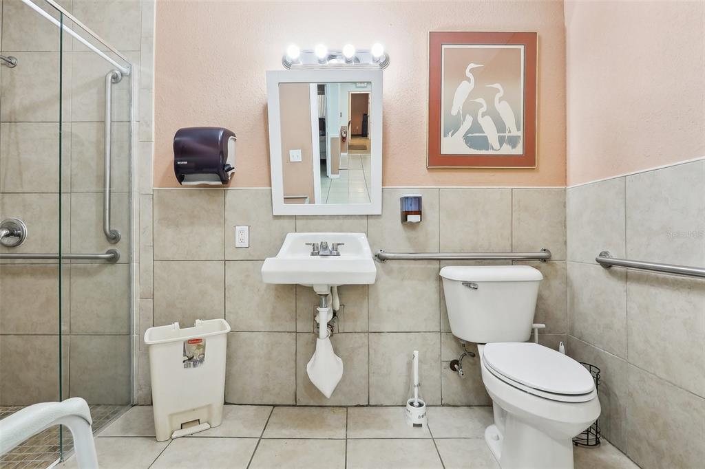 201 Rosefield Avenue Leesburg, FL 34748 - Photo 28 of 43 a white toilet sitting next to a bathroom sink