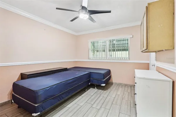 a living room with a bed furniture and a window