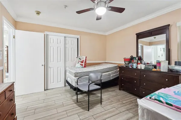 a bed room with a bed and a dresser