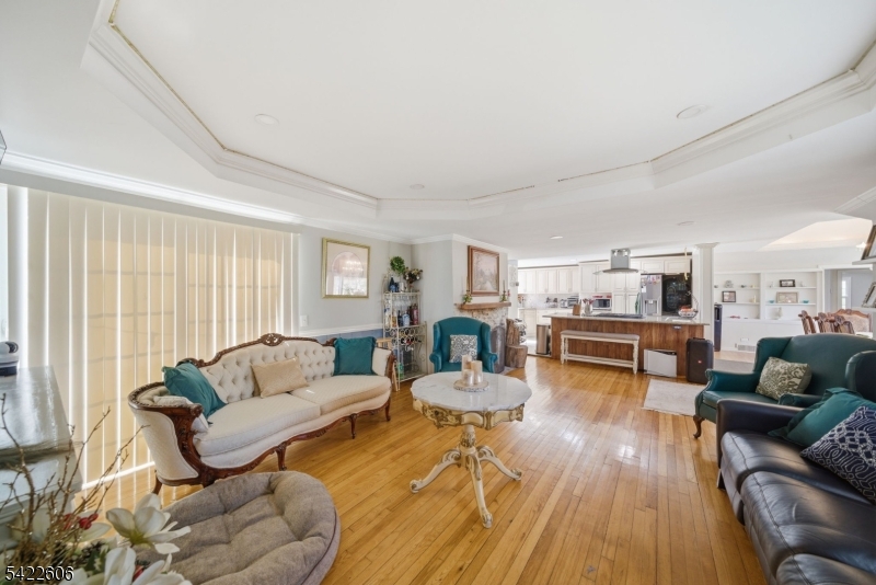 399 Springbrook Trail Sparta, NJ 07871 - Photo 4 of 27 a living room with furniture and a wooden floor