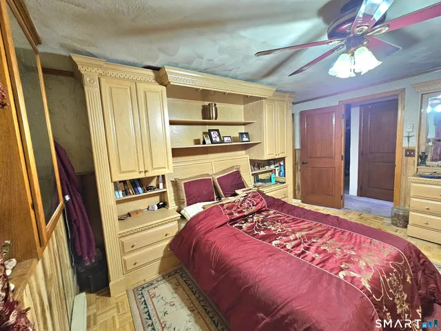 a bedroom with a bed and a dresser