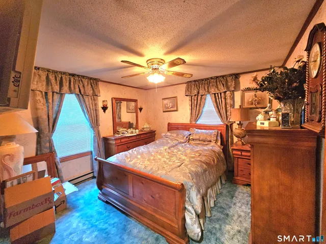 a bed room with a bed and a window