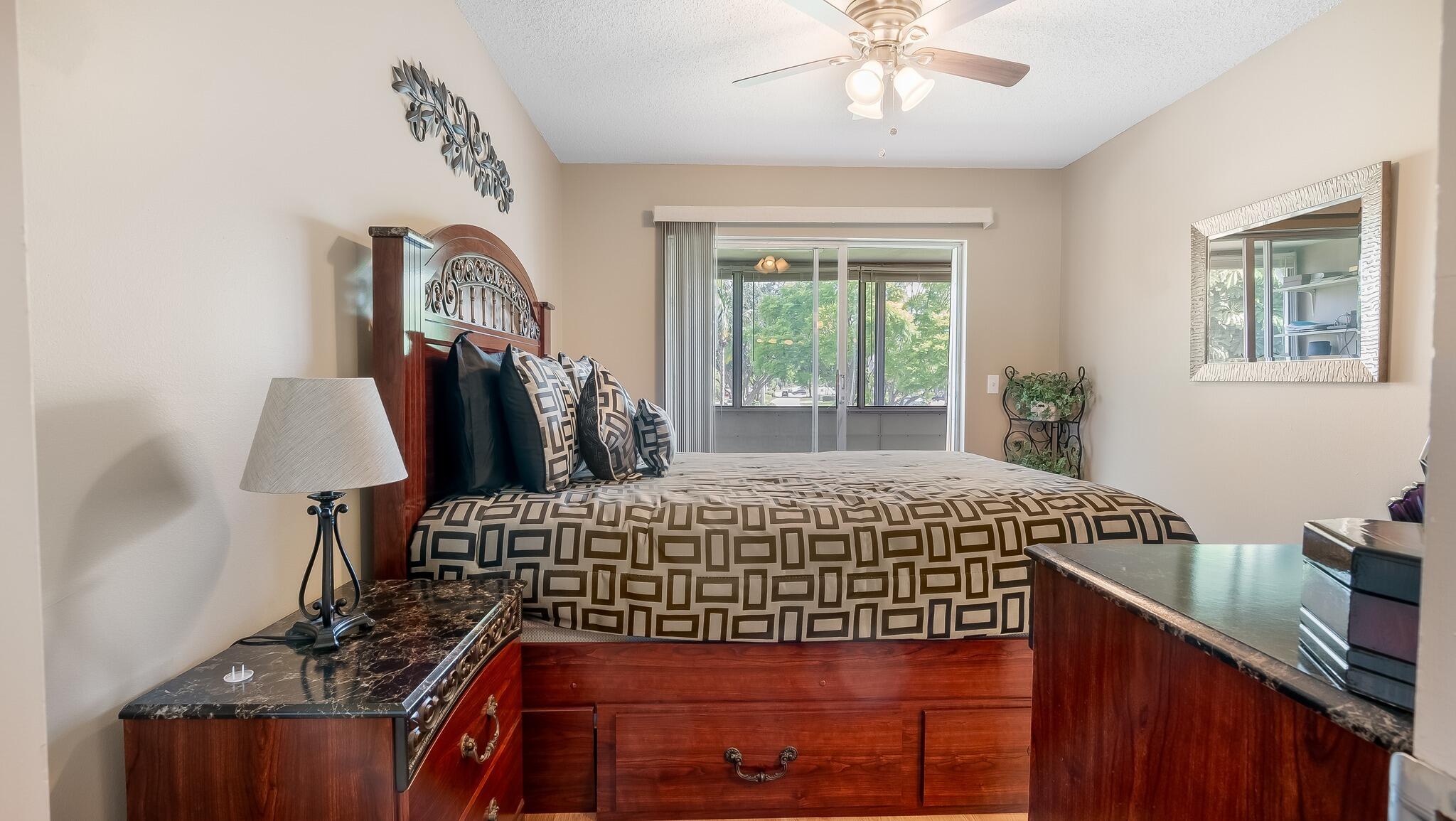 239 Windsor K West Palm Beach, FL 33417 - Photo 7 of 11 a bedroom with a bed and a chandelier