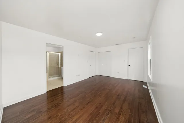 a bathroom with a double vanity sink and mirror
