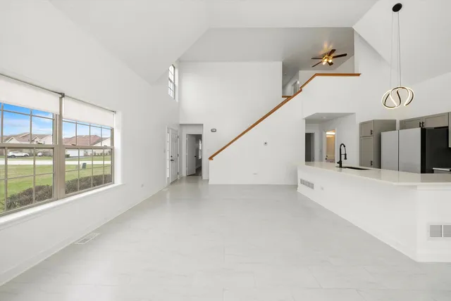 a view of a room with entryway and kitchen view