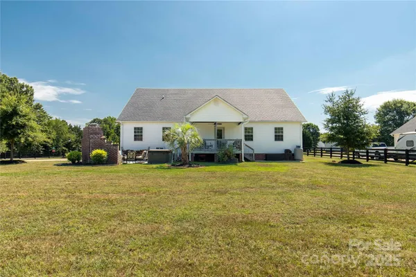 a view of a balcony with furniture