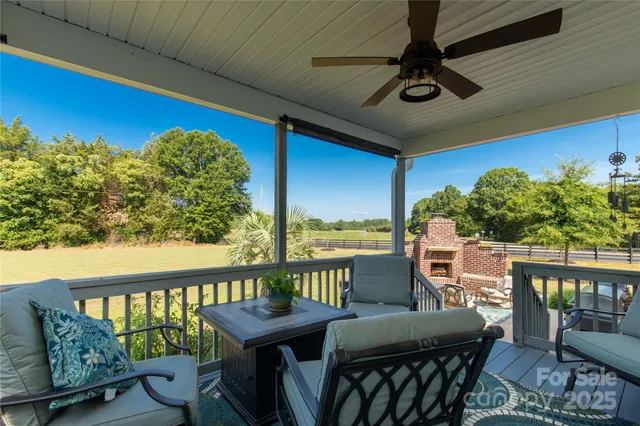 a view of a dining room with furniture and a window