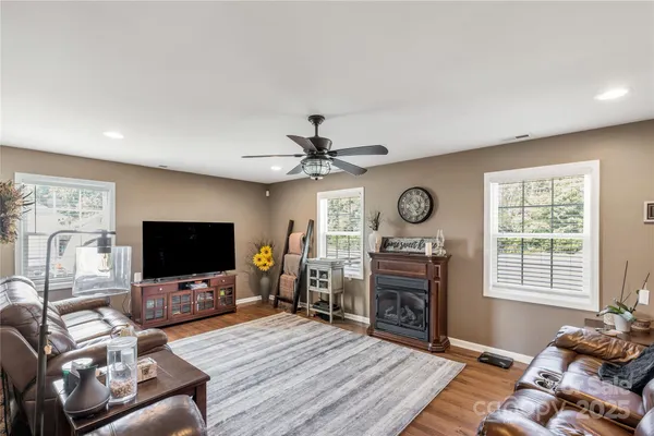 a living room with furniture or couch and a wooden floor