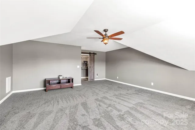 a view of a livingroom with a ceiling fan