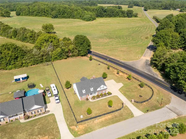 an aerial view of a house with a ocean view