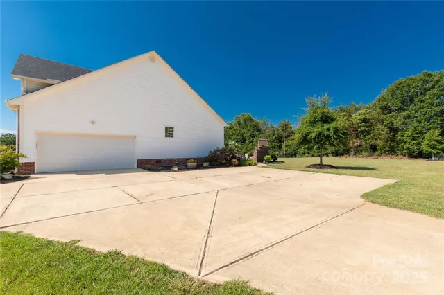 a backyard of a house with yard and outdoor seating