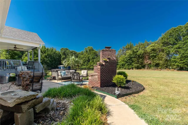 a bedroom with bed and wooden floor