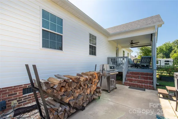a view of a chairs and table in the patio
