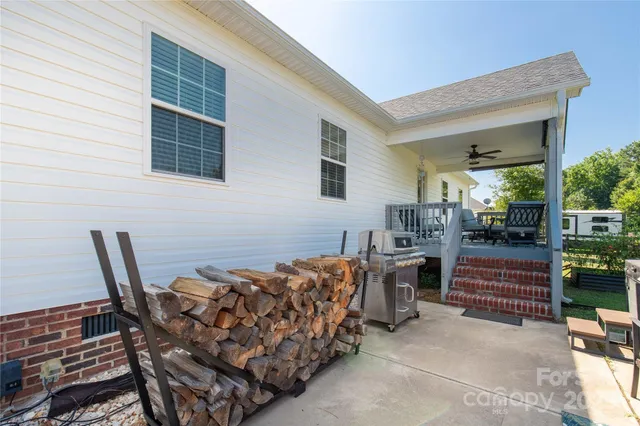 a view of a chairs and table in the patio