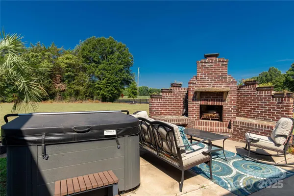 a view of a chair and table on the wooden floor
