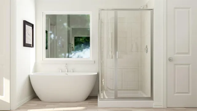a white bath tub sitting next to a shower