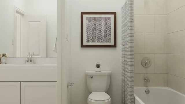a bathroom with a toilet sink and shower