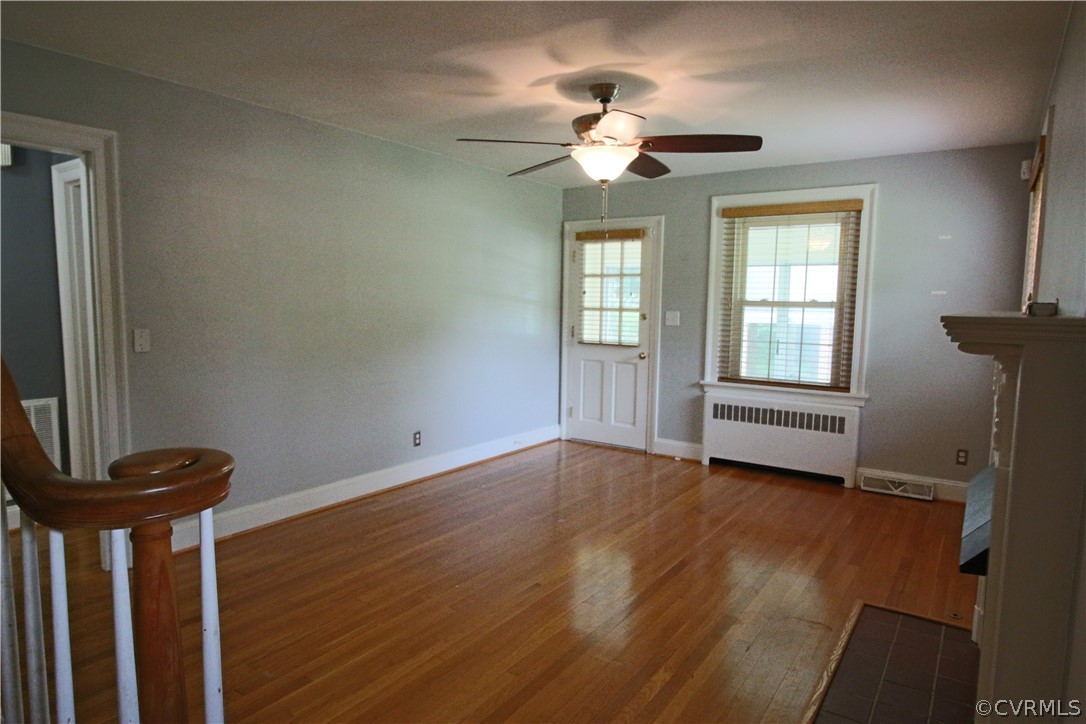 11268 Hanover Courthouse Road Hanover, VA 23069 - Photo 5 of 21 a view of an empty room with a window and wooden floor