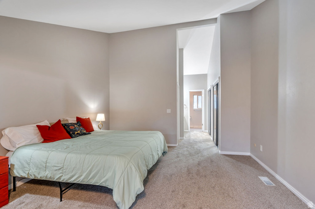3221 North Shadowbrook Circle Provo, UT 84604 - Photo 11 of 29 Bedroom featuring light carpet and a high ceiling