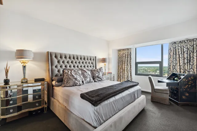 a bedroom with a bed and a couch