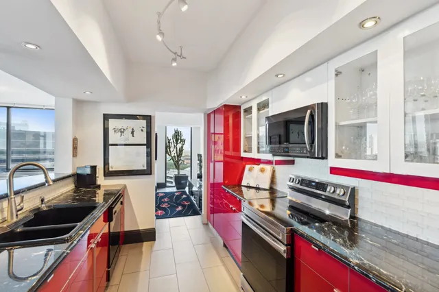 a kitchen that has a lot of cabinets